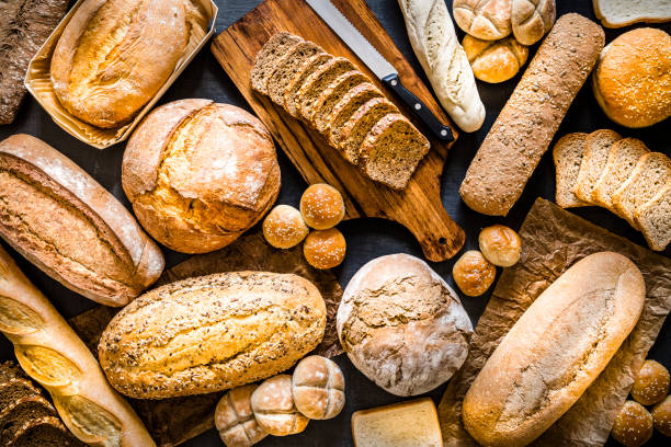 Assorted fresh breads on background